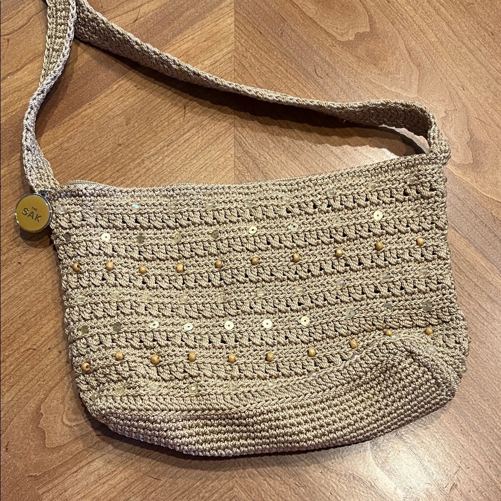 The Sak Beige Crochet Shoulder Bag with Gold Accents